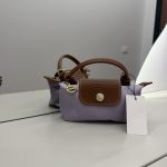 Çantë Longchamp Le Pliage Mini, elegant brown and lavender design.