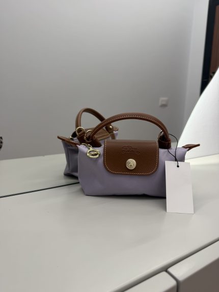Çantë Longchamp Le Pliage Mini, elegant brown and lavender design.