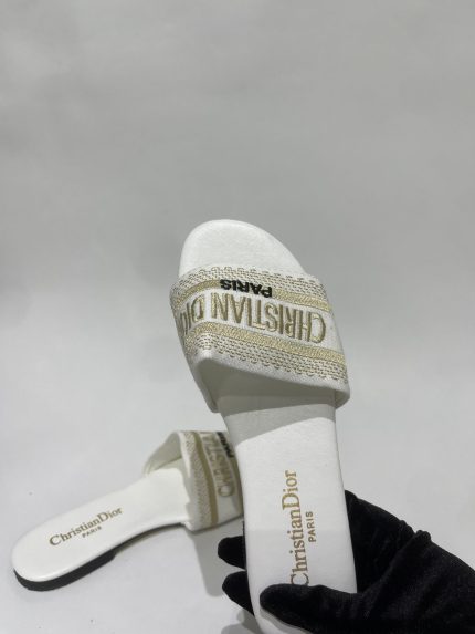 Christian Dior Slide E Zeze elegant white sandal with gold accents.