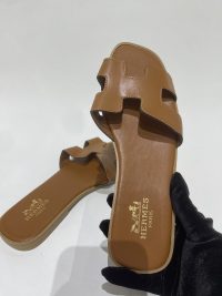 Brown Hermes sandals for women, elegant and stylish design.