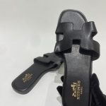 Black Hermes sandals for women, elegant and stylish design.