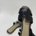 Black Hermes Oran Sandal, women's luxury footwear, leather design.