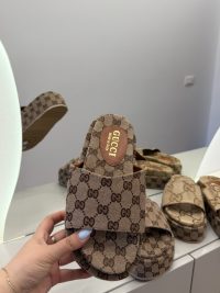Gucci GG Monogram Platform sandals for women on display.