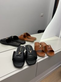 Hermes Oran Klasike sandals, black and brown, elegant women's footwear.