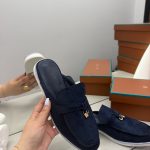 Loro Piana navy suede loafers with gold accents, luxury women's footwear.