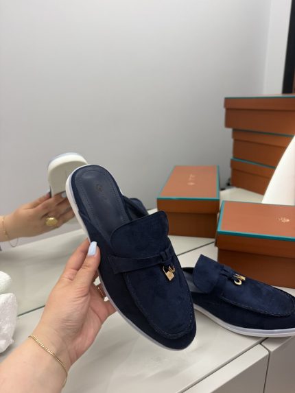Loro Piana navy suede loafers with gold accents, luxury women's footwear.