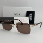 Men's Boss sunglasses with brown lenses and gold accents.