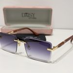 Cartier sunglasses with gradient lenses and gold accents in case.