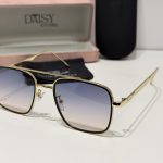 Elegant Cartier sunglasses with gold frame and gradient lenses.