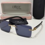 Elegant Cartier sunglasses with gold accents and protective case.