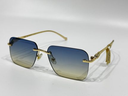 Cartier sunglasses with gold frame and gradient lenses.