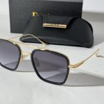 Men's Dita sunglasses with gold frame and black case.