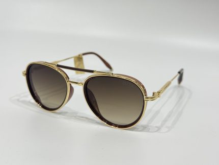 Gold-rimmed Dita sunglasses with gradient lenses on white background.