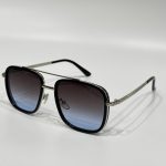 Stylish gradient lens sunglasses with metal frame for eye protection.
