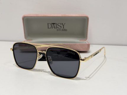 Gucci sunglasses with gold frame and black lenses in case.
