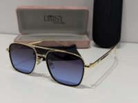 Gucci sunglasses with gold frame and gradient lenses in case.