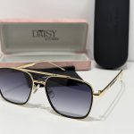 Gucci sunglasses with gold frame and gradient lenses, elegant case included.