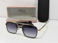 Gucci sunglasses with gold frame and gradient lenses, elegant case included.