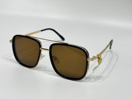Men's Louis Vuitton sunglasses with gold accents and brown lenses.