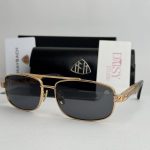 Luxury Maybach men's sunglasses with gold frame and black lenses.