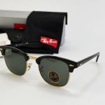Ray-Ban sunglasses with case and packaging on display.