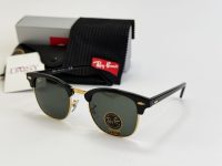 Ray-Ban sunglasses with case and packaging on display.
