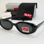 Ray-Ban sunglasses with case and cleaning cloth, UV protection.