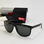 Ray-Ban sunglasses with case and cleaning cloth on display.