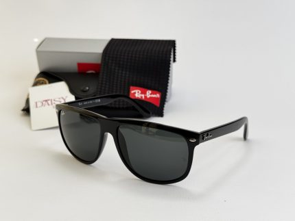 Ray-Ban sunglasses with case and cleaning cloth on display.