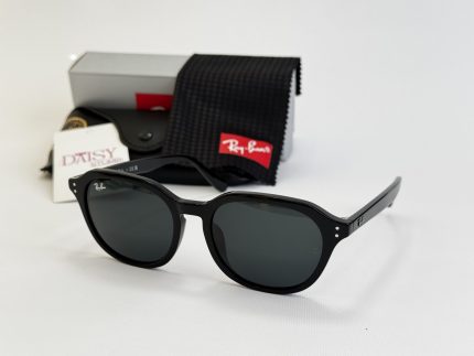Ray-Ban sunglasses with case and cleaning cloth displayed elegantly.