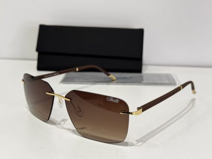 Men's Silhouette sunglasses, brown lenses, gold accents, stylish protection.
