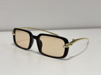 Bottega Veneta sunglasses with black frame and gold accents.