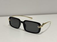 Bottega Veneta sunglasses with black frames and gold temples.