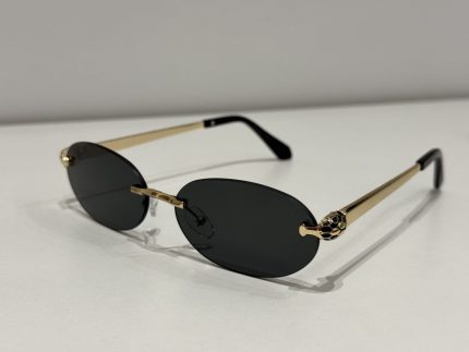 BVLGARI Serpenti sunglasses with gold accents and dark lenses.