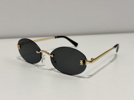 Cartier rimless sunglasses with gold temples on white background.
