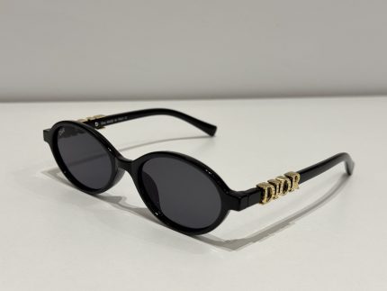 Dior oval sunglasses, elegant black design for women.