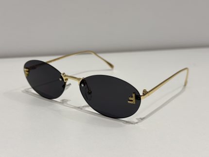 Fendi rimless sunglasses, elegant gold frame, dark lenses.