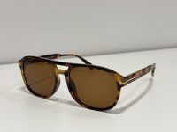 Tom Ford Aviator sunglasses, tortoiseshell frame, brown lenses, elegant design.