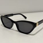 Versace cat-eye sunglasses, black with gold accents, elegant design.