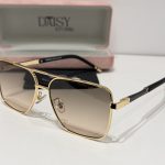 Versace sunglasses with gold frame and gradient lenses in case.