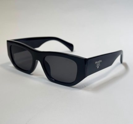 Prada women's sunglasses, elegant black design with UV protection.