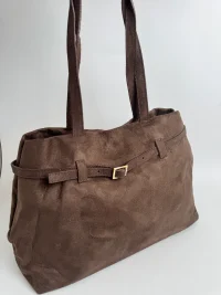 Brown suede women's handbag with elegant buckle detail.