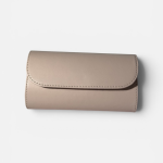 Elegant beige women's clutch purse on white background.