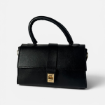 Elegant black handbag with gold clasp and handle.