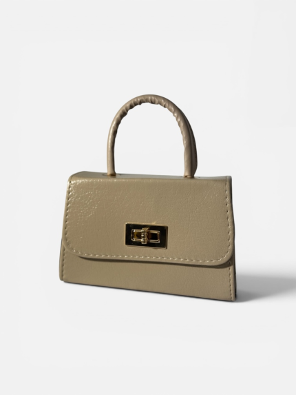 Elegant beige handbag with gold clasp and handle.