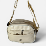 Elegant beige women's handbag with zipper pockets and adjustable strap.