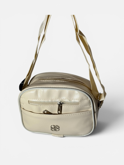 Elegant beige women's handbag with zipper pockets and adjustable strap.