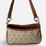 Elegant beige women's bag with brown leather strap.