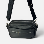 Elegant black women's bag with adjustable strap and zippers.