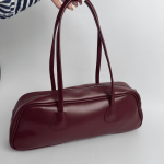 Elegant burgundy women's handbag with long handles